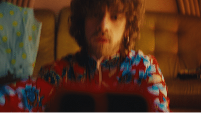 a blurry photo of a person sitting in a chair