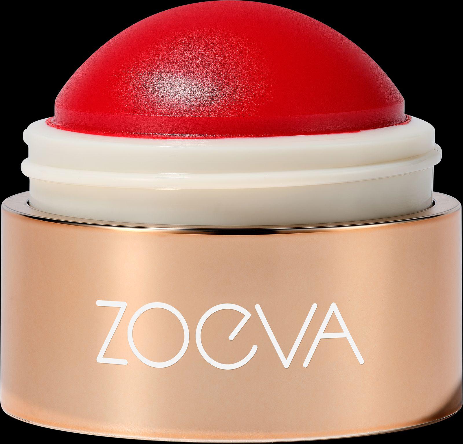 a close up of a red and white container on a black background