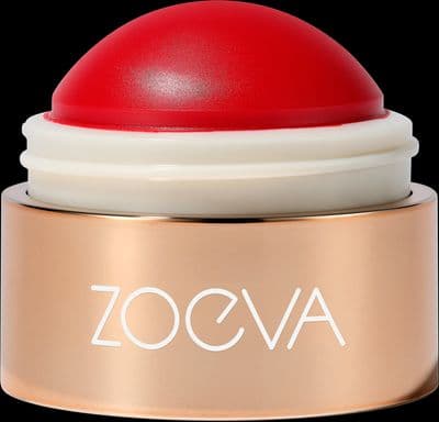 a close up of a red and white container on a black background
