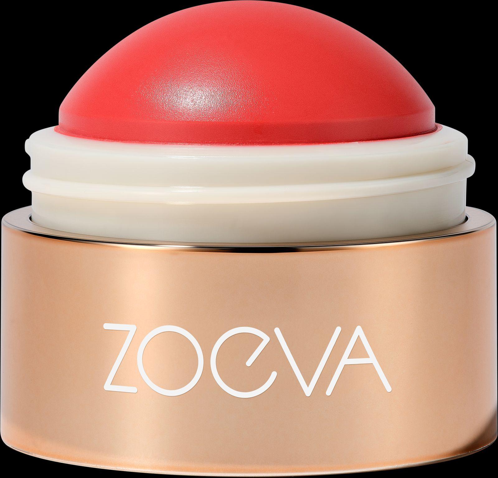 a close up of a red and white container on a black background