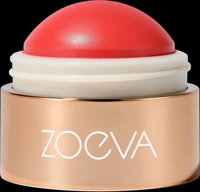 a close up of a red and white container on a black background