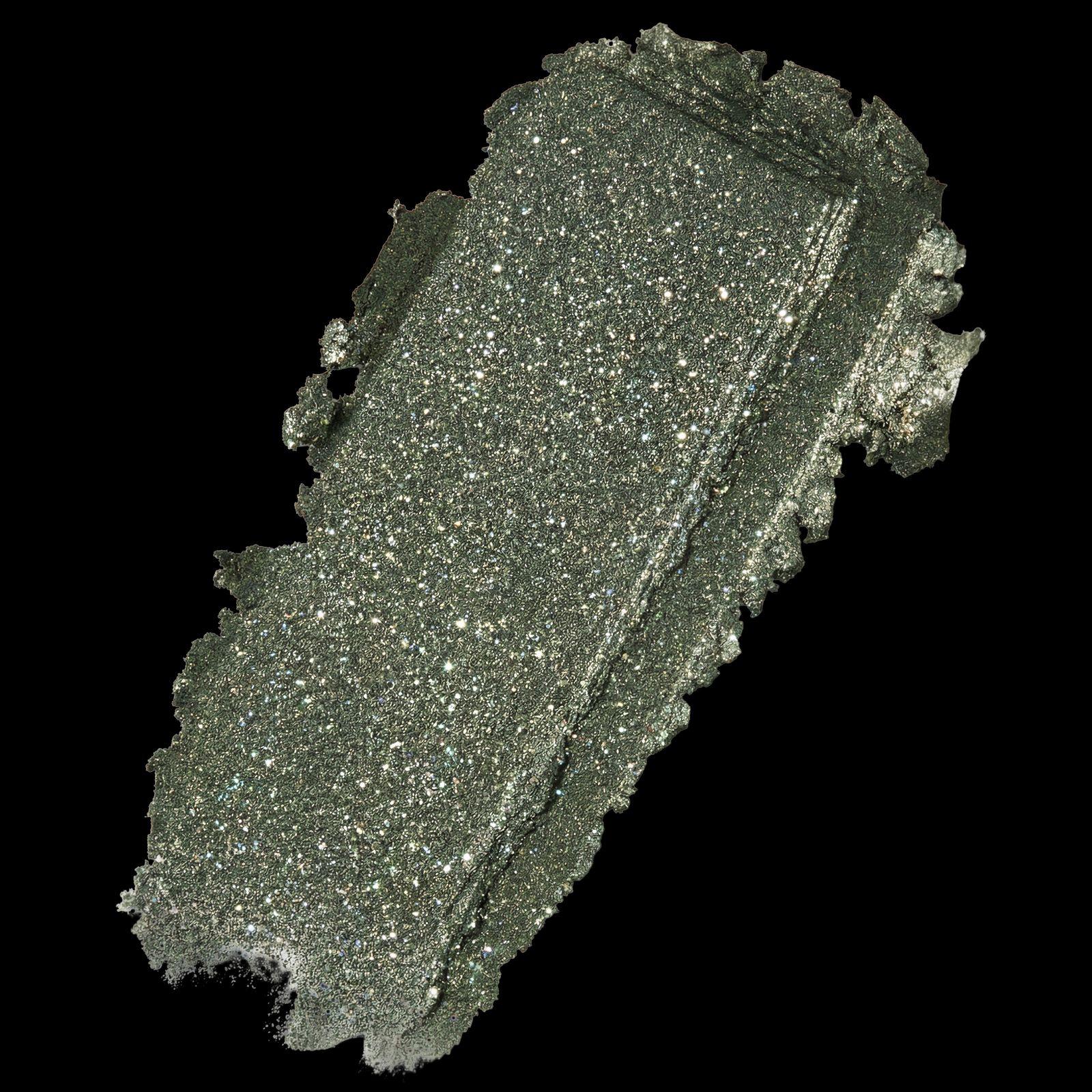 a close up of a piece of silver glitter