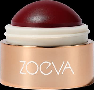 a close up of a red and white container on a black background