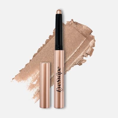 a close up of a liquid eyeliner and a brush on a white background