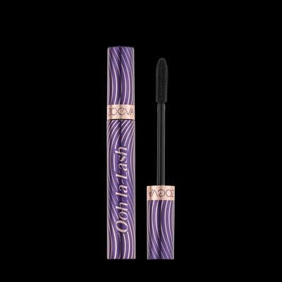 a purple mascara with a black brush in it
