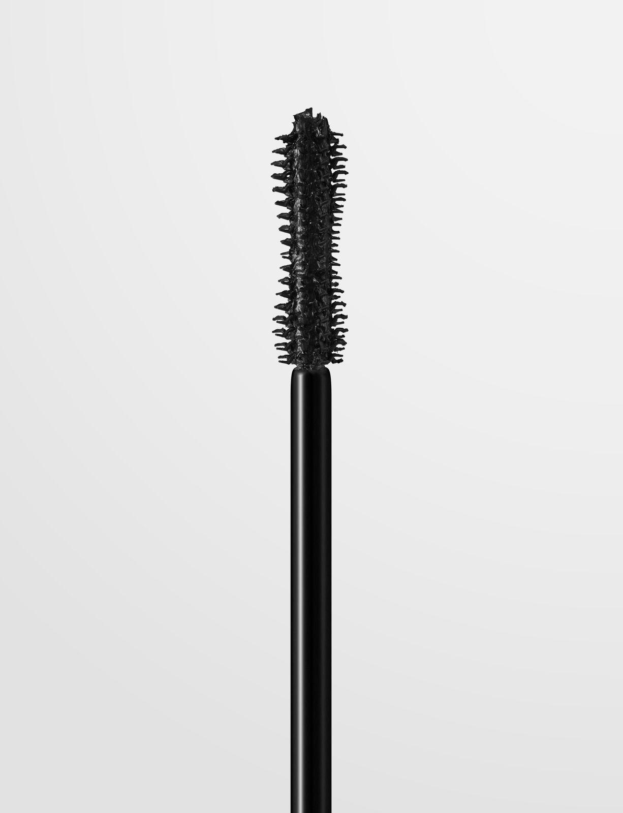 a black mascara with a black handle on a white background