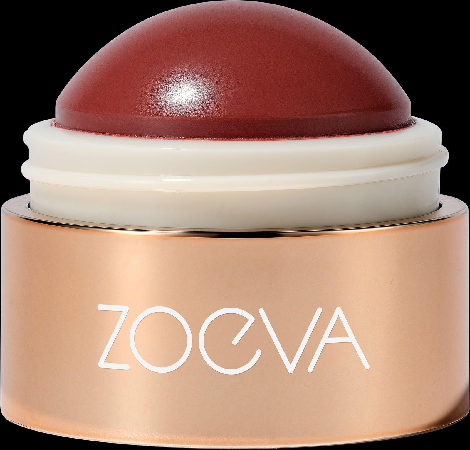 a close up of a red and white container on a black background