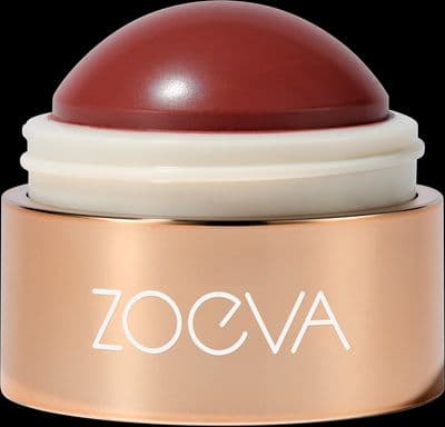 a close up of a red and white container on a black background