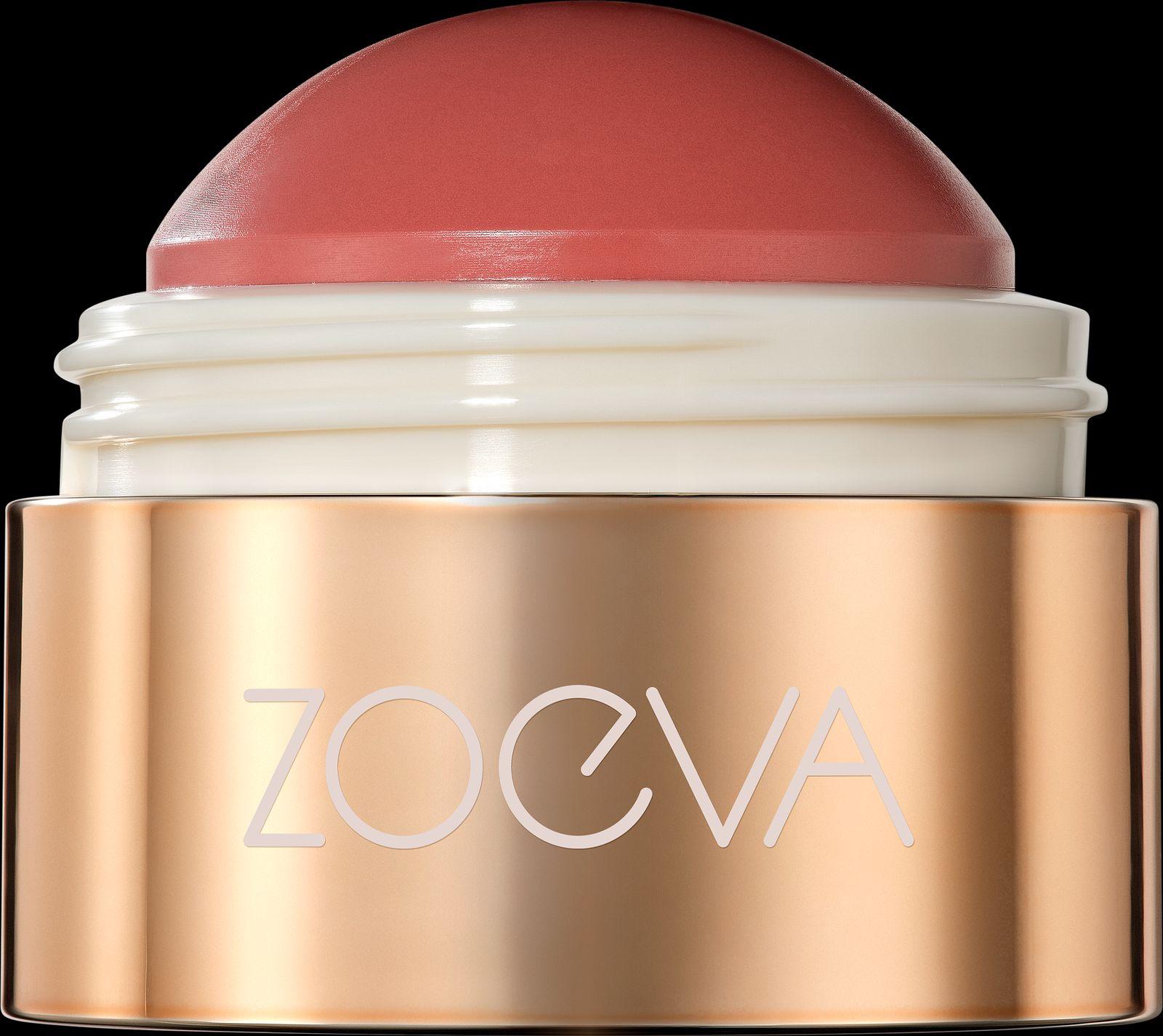 a close up of a pink lipstick on a black background