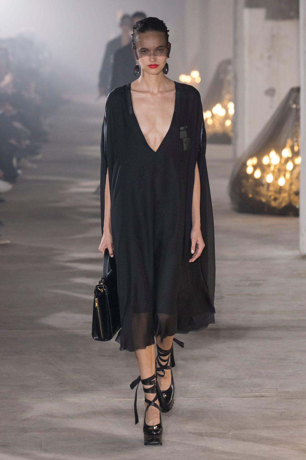 a model on the runway of a fashion show