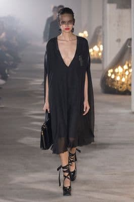 a model on the runway of a fashion show