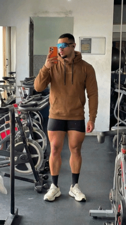 a man taking a selfie in a gym