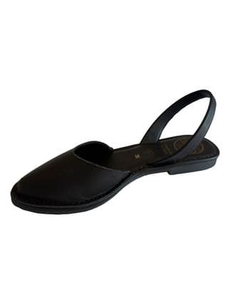 a woman's black shoe on a white background