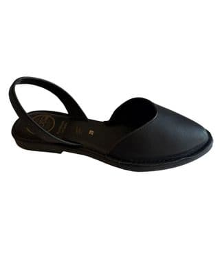 a woman's black shoe with a strap