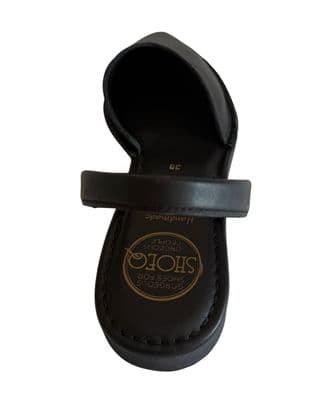a pair of black sandals with a gold logo