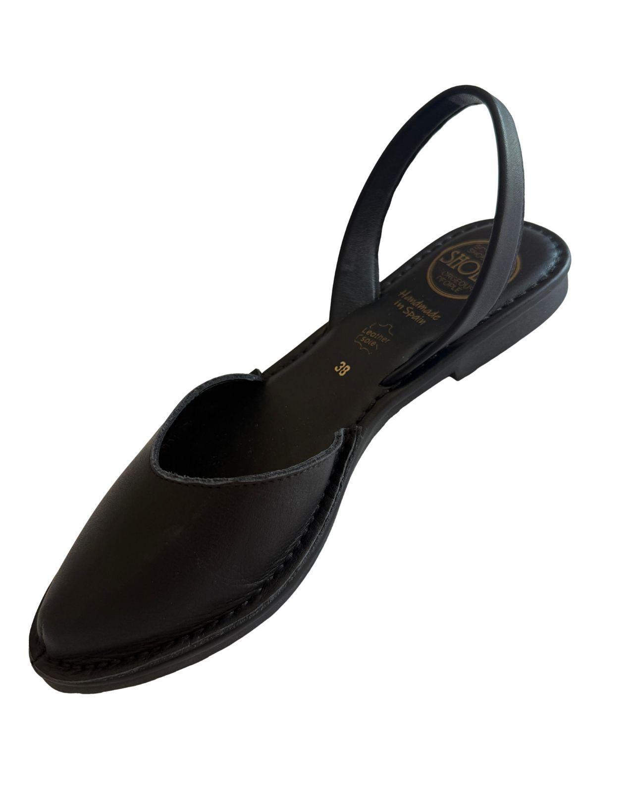 a women's shoe with a black strap