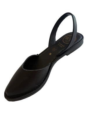 a women's shoe with a black strap