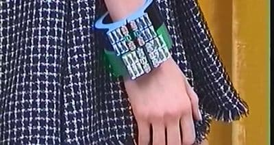 a close up of a person wearing a bracelet