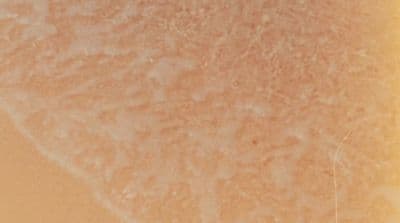 a close up of a cell phone with a yellow background