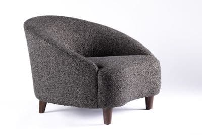 a gray chair with wooden legs and a white background