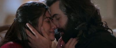 a man and a woman kissing each other