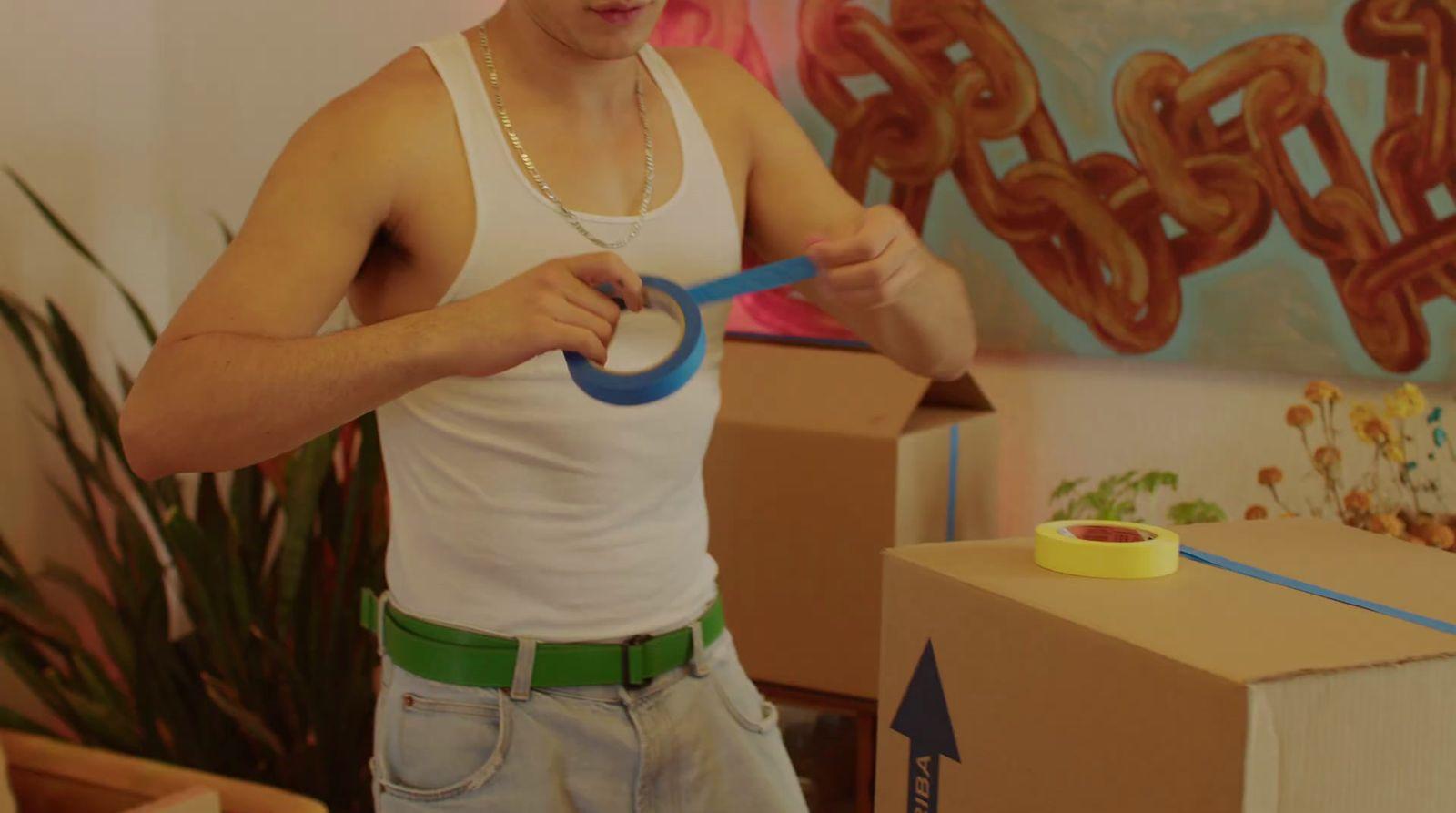 a man holding a pair of scissors in his hands