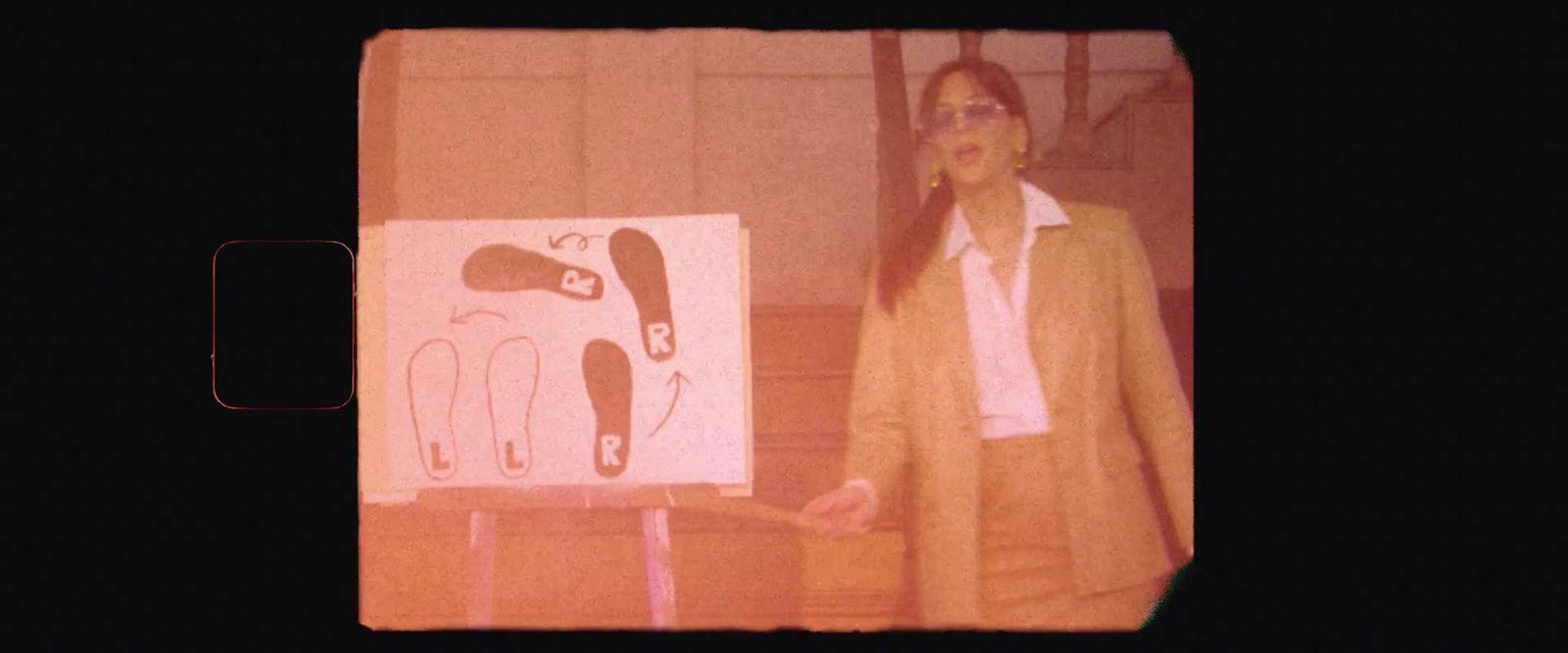 a man standing in front of a painting