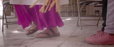 a couple of people standing next to each other