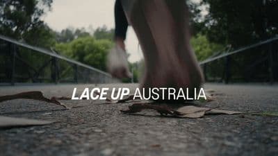 a close up of a person running on a path