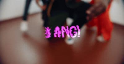a blurry image of a person dancing on a wooden floor