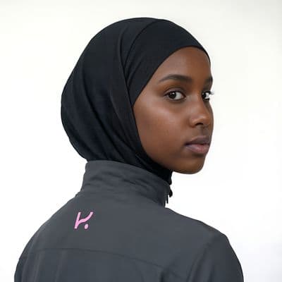 a woman wearing a black head scarf and a black jacket