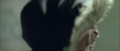 a blurry image of a woman with blonde hair