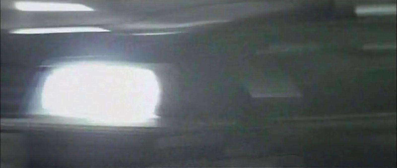 a blurry image of a television screen with a light on it