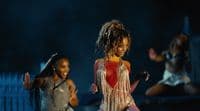 a group of young women dancing on stage
