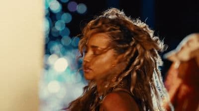 a close up of a person with long hair