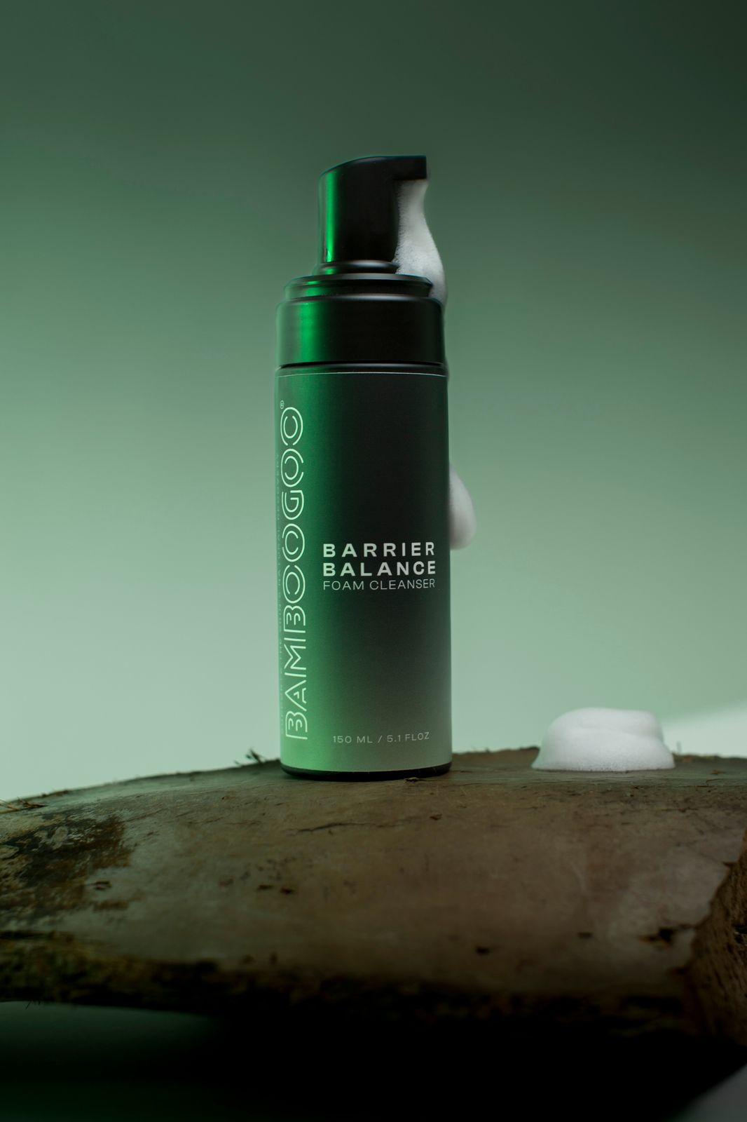 a bottle of shampoo sitting on top of a piece of wood
