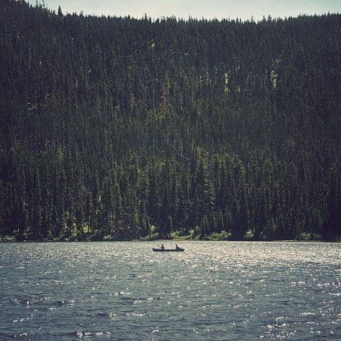 a person in a boat on a large body of water