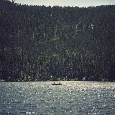 a person in a boat on a large body of water