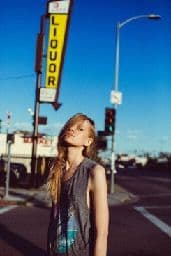 a woman standing in the middle of a street