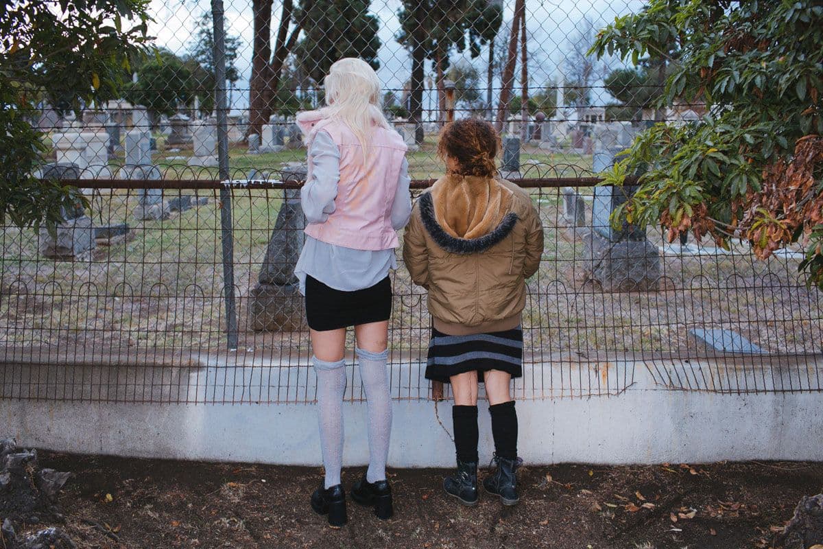 a couple of women standing next to each other