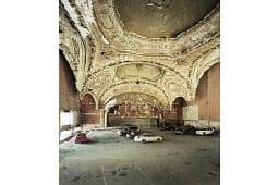 a large room with a ceiling that has a painting on it