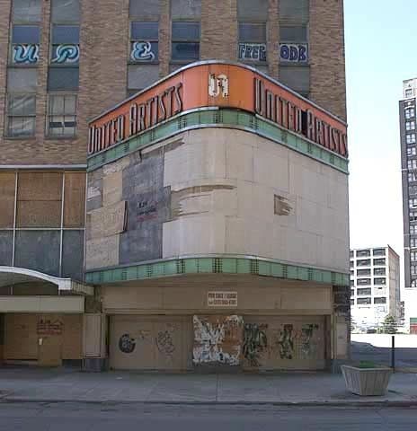a large building with graffiti on the side of it