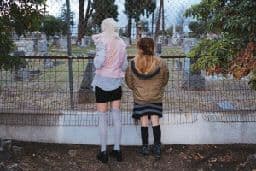a couple of people standing next to each other