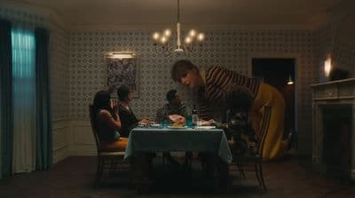 a group of people sitting around a table