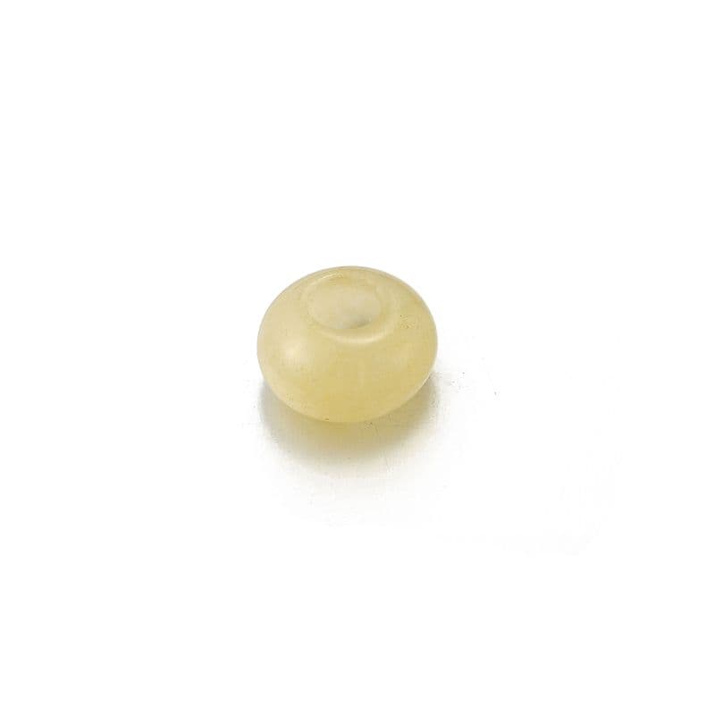 a white donut sitting on top of a white table