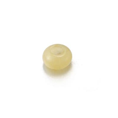 a white donut sitting on top of a white table