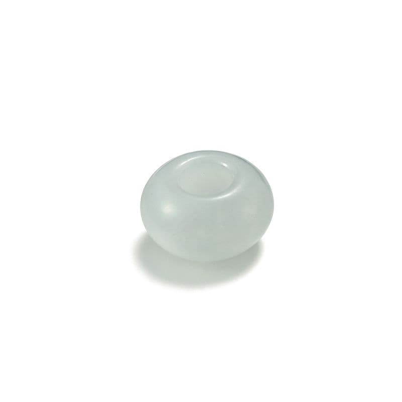 a white glass ball sitting on top of a white surface