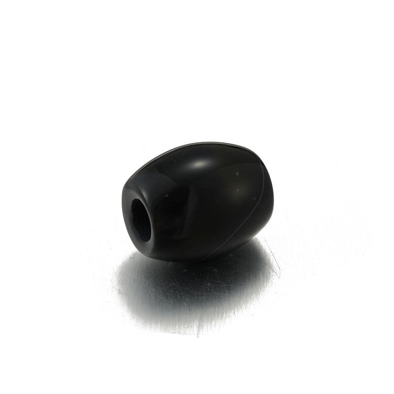 a black object sitting on top of a white surface
