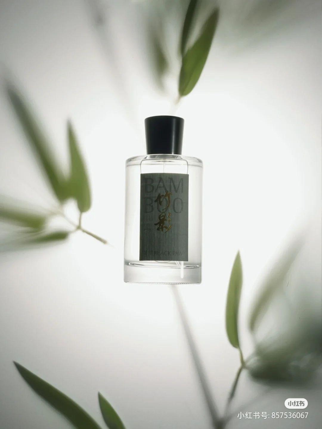 a bottle of perfume sitting on top of a table