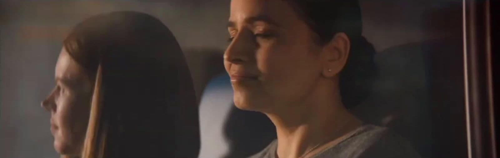 a woman looking at herself in a mirror